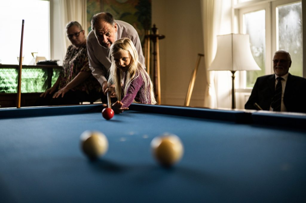 family playing pool